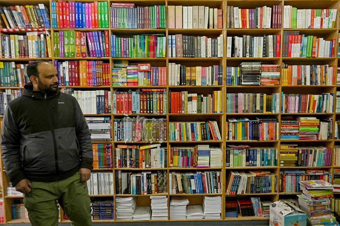A man visits a bookshop in Srinagar on February 18, 2025. Police in Indian-administered Kashmir have raided dozens of bookshops across the disputed territory since February 15, and seized hundreds of copies of books authored by Abul A'la Maududi, a pre-eminent Islamic scholar and founder of Jamaat-e-Islami (JI), sparking angry reactions by Muslim leaders. (Photo by Tauseef MUSTAFA / AFP)