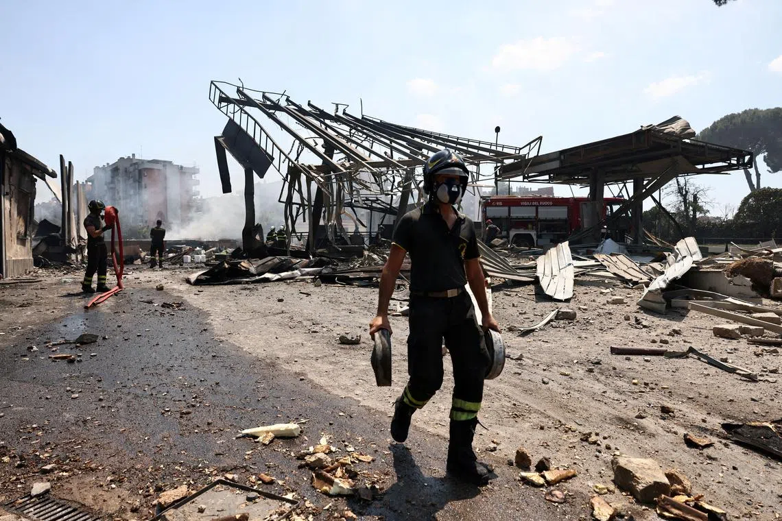 Firefighters working at the scene of the blast, on the outskirts of Rome, on July 4.