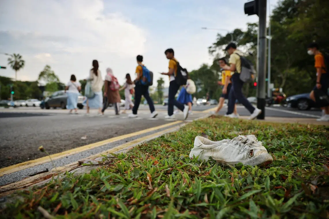 A damaged white shoe seen at the scene of an accident at the junction of Dover Road and North Buona Vista Road on Apr 1, 2024.