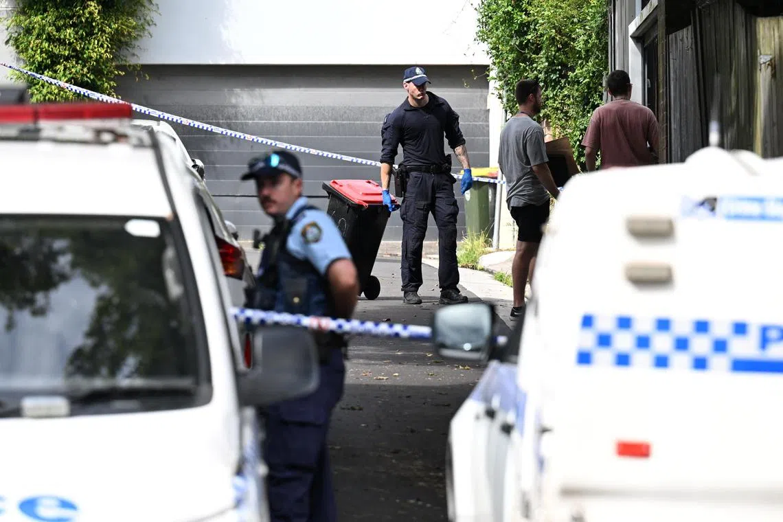 Police officers work at a crime scene at Waite Road in Paddington, Sydney.