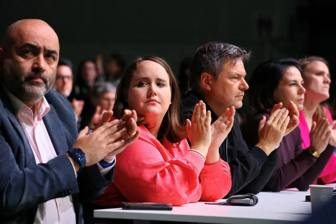 Germany's Greens party co-leaders Omid Nouripour, Ricarda Lan, German Economy and Climate Protection Minister Robert Habeck and German Foreign Minister Annalena Baerbock applause during the 49th Greens party convention in Rheinstetten, near Karlsruhe, Germany, November 25, 2023. REUTERS/Wolfgang Rattay