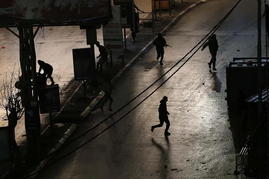 Palestinian militants clashing with the Israel Defence Force at Jenin refugee camp near the West Bank city of Jenin, Dec 13, 2023. 