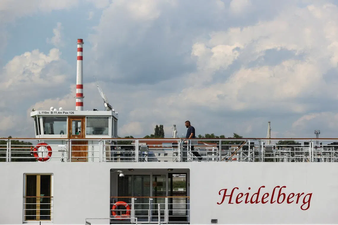 FILE PHOTO: A man walks on the river cruise ship 'Heidelberg', following a deadly accident due to a suspected collision involving a small motor boat and a river cruise ship on the Danube River north of Budapest, in Komarom, Hungary, May 19, 2024. REUTERS/Bernadett Szabo/File Photo