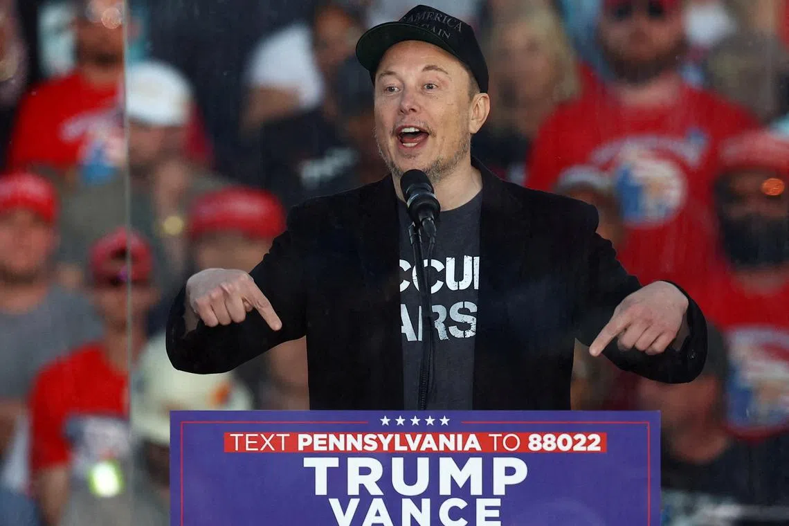 FILE PHOTO: Tesla CEO and X owner Elon Musk speaks during a rally for Republican presidential nominee and former U.S. president Donald Trump, at the site of the July assassination attempt against Trump, in Butler, Pennsylvania, U.S., October 5, 2024. REUTERS/Carlos Barria/File Photo