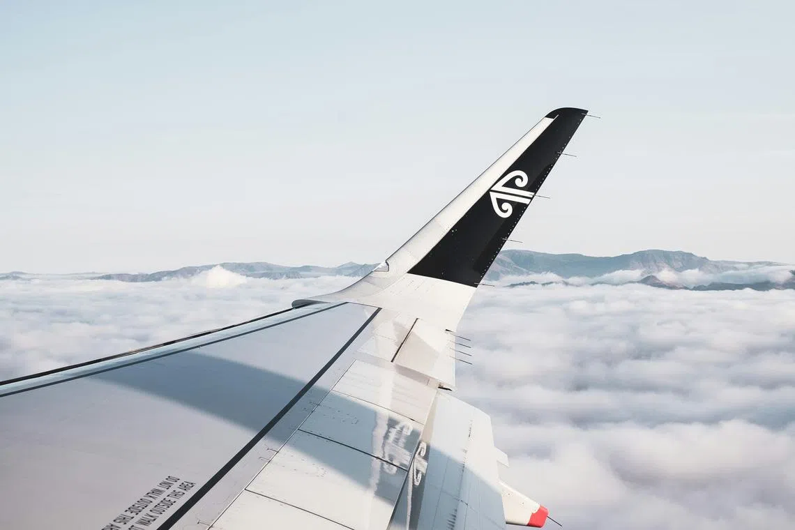 A passenger suffered burns after a pot of hot coffee poured onto her, while a crew member reportedly hit the ceiling.