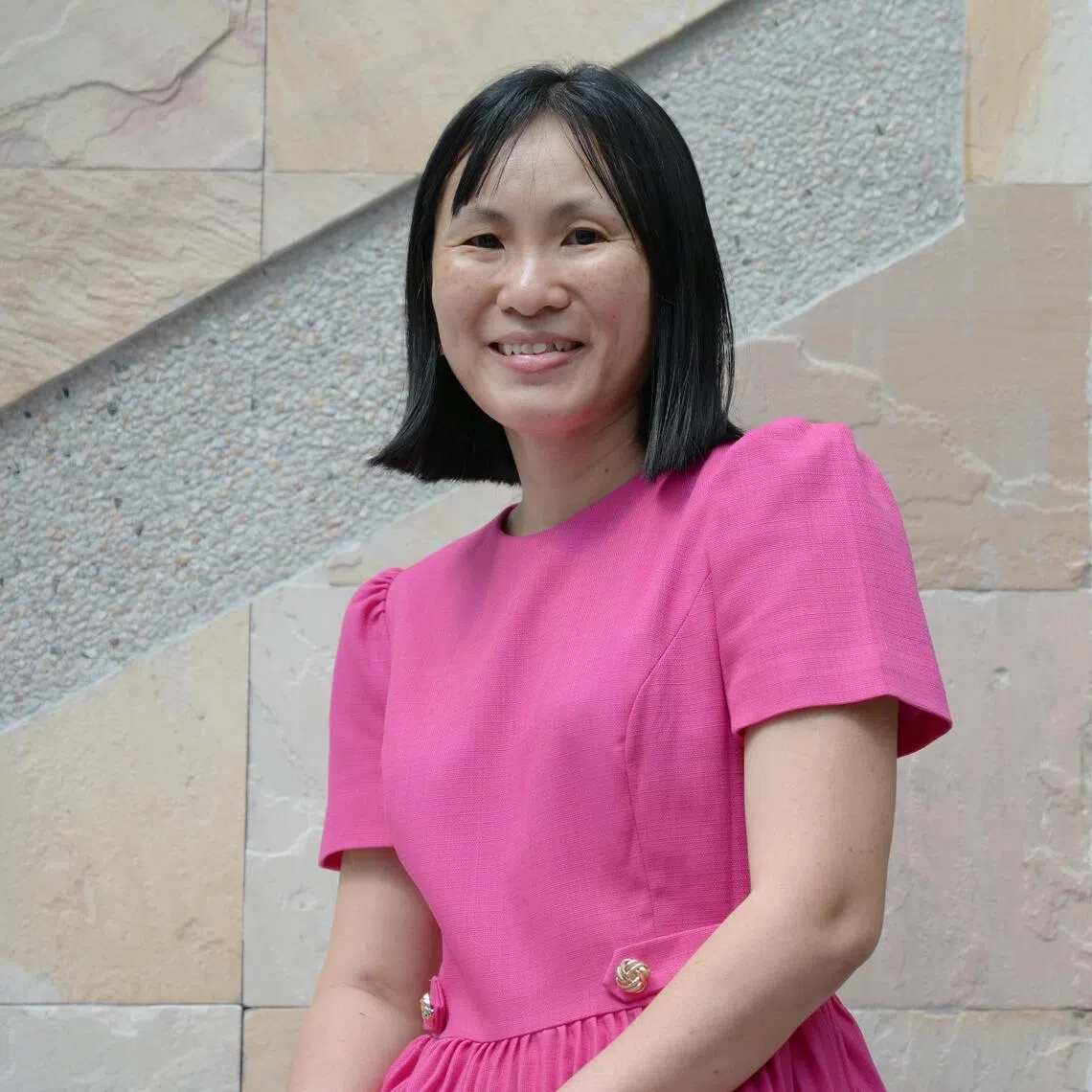 Oncoplastic breast surgeon Lim Geok Hoon and one of her innovations, a half-body breast mould created using 3D printing technology. 
