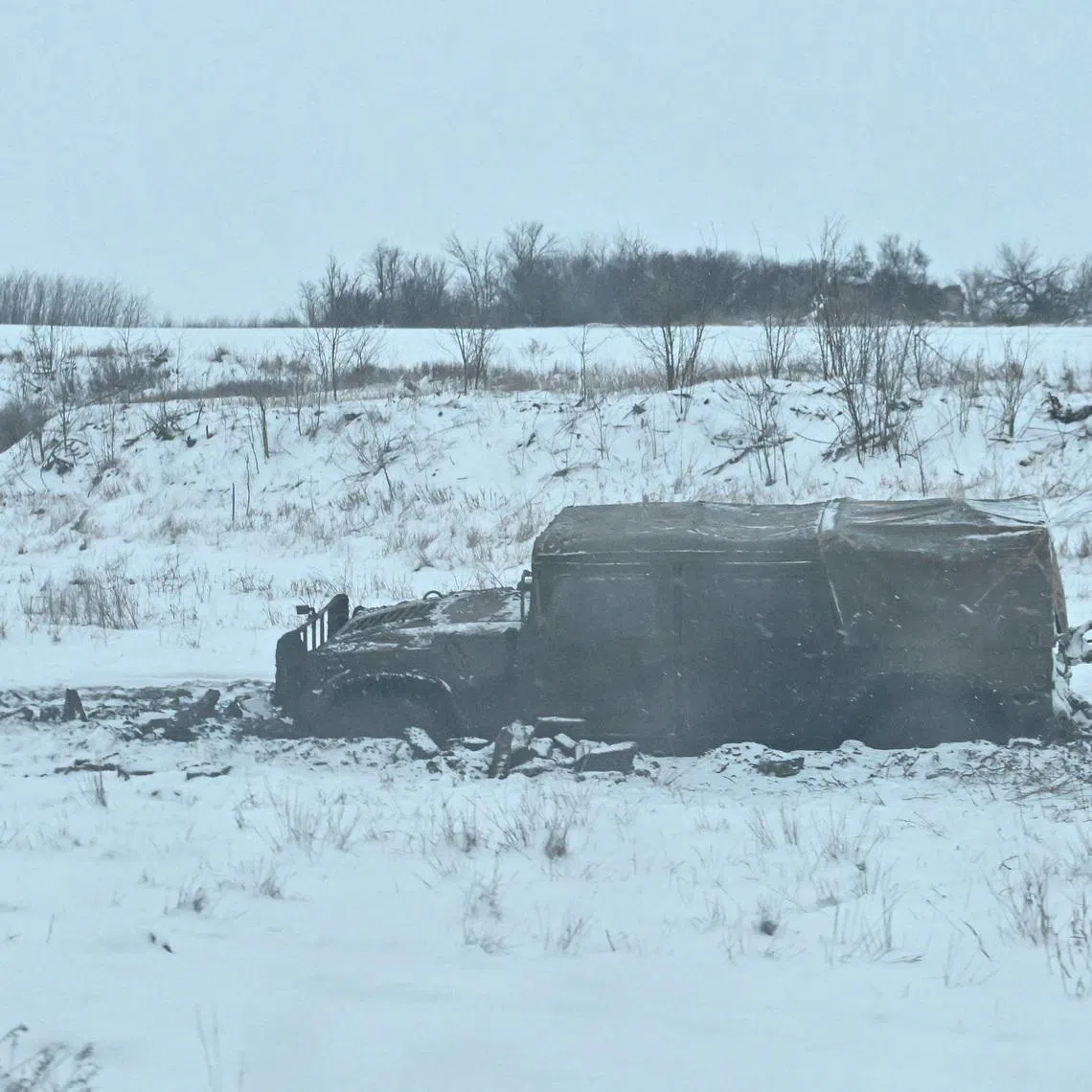 A Humvee of Ukrainian servicemen stuck in mud near a front line, amid Russia's attack on Ukraine, in Zaporizhzhia region, Ukraine January 16, 2026. REUTERS/Stringer