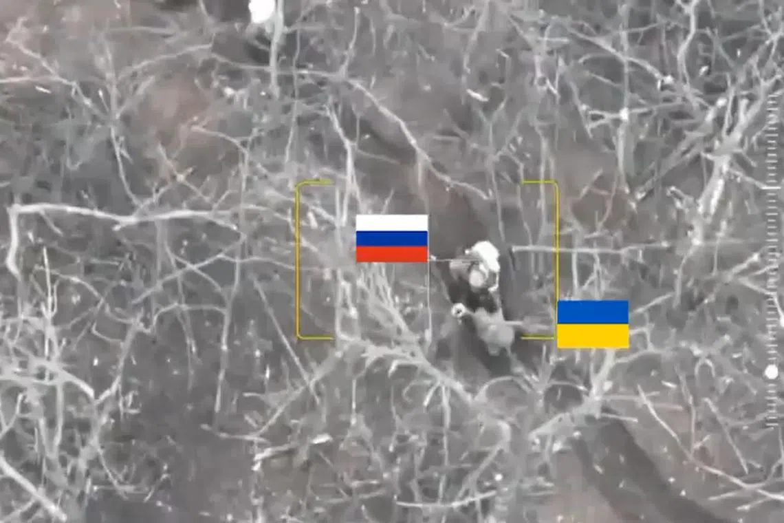 Two soldiers labelled as Ukrainian run towards another labelled as Russian in a trench. The Russian soldier grabs them and shoots numerous times.