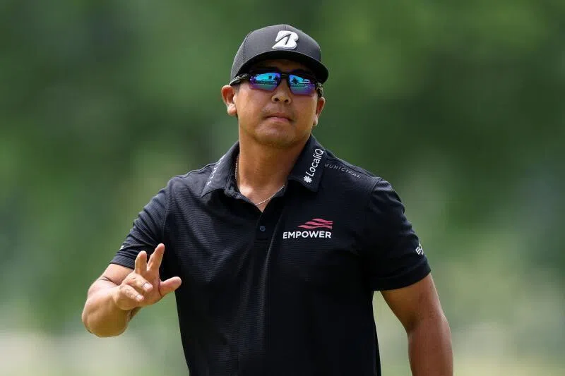 Kurt Kitayama acknowledges the crowd on the 18th green during the final round of the PGA Championship at Aronimink Golf Club on May 17, 2026 in Newtown, Pennsylvania.