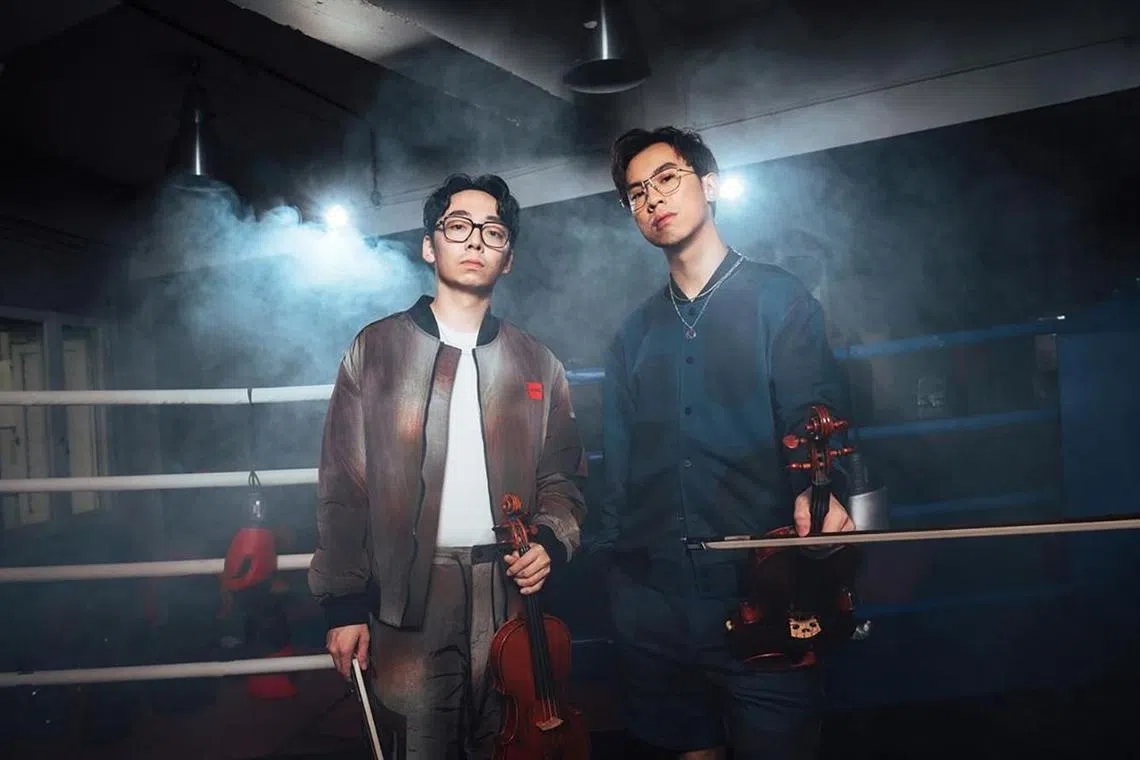 TwoSet Violin, which comprises Brett Yang (left) and Eddy Chen (right)  will be back in Singapore to for a concert with bass player Davie504.