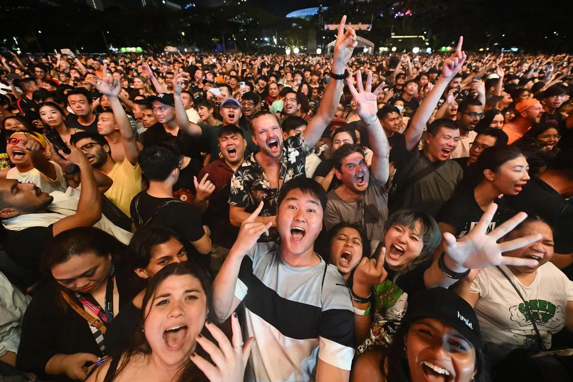  Fans watching Green Day perform on the Padang stage at the Formula One Singapore Grand Prix on Oct 2, 2022.