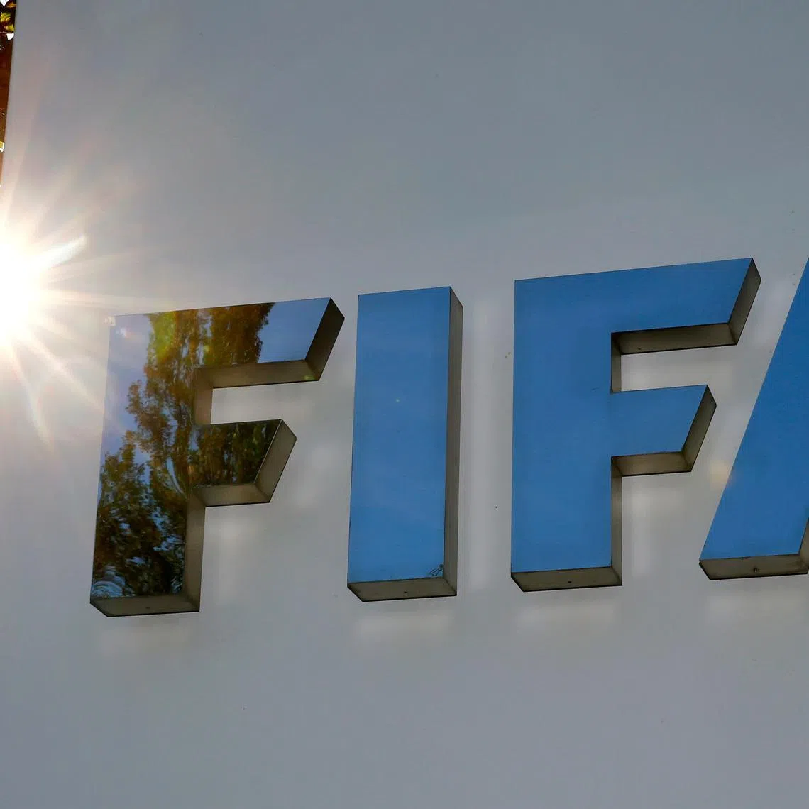 FILE PHOTO: The logo of FIFA is seen in front of its headquarters in Zurich, Switzerland September 26, 2017.   REUTERS/Arnd Wiegmann/File Photo