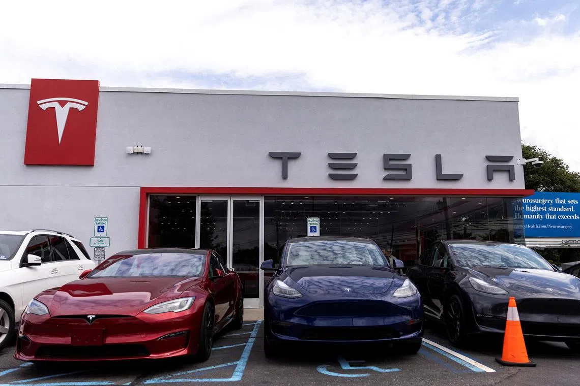 FILE PHOTO: Tesla electric vehicles are parked in a Tesla dealer in Paramus, New Jersey, U.S., July 23, 2024.  REUTERS/Eduardo Munoz/File Photo