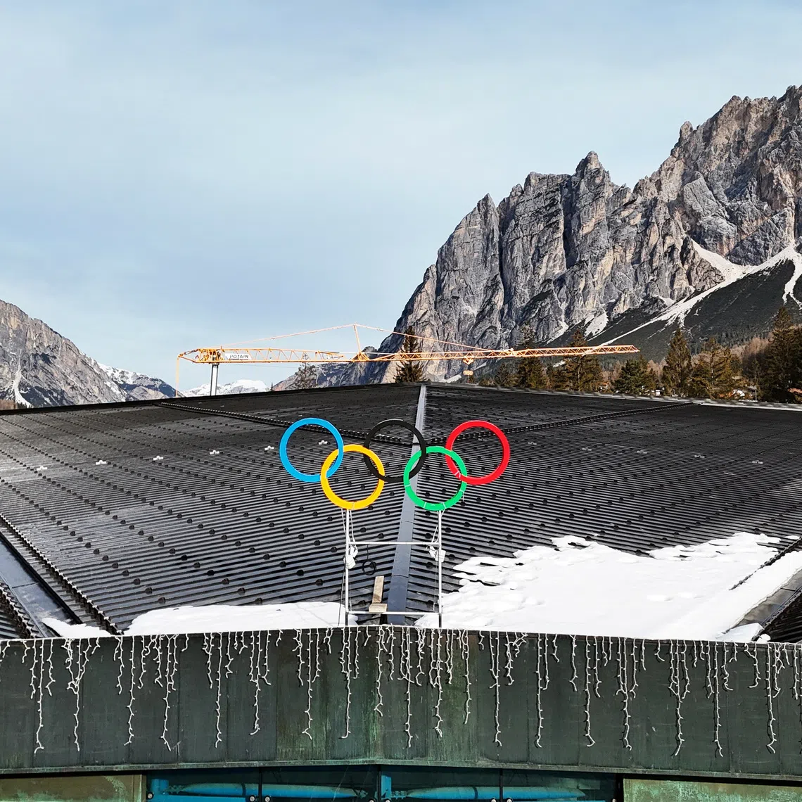 An aerial view shows the Olympics rings on the Cortina Curling Olympic Stadium, which will host the curling, wheelchair curling, and Paralympic closing ceremony, during the Milano Cortina Winter Olympic Games 2026, in Cortina, Italy, January 25, 2025. REUTERS/Claudia Greco
