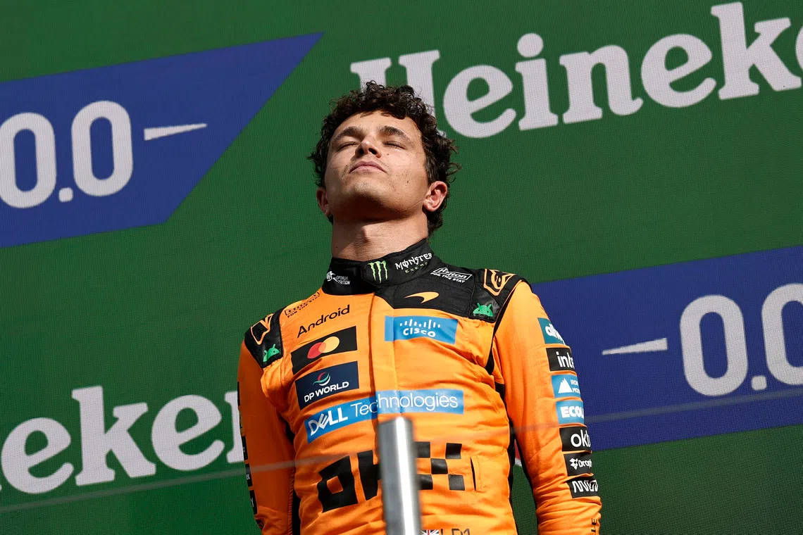 McLaren’s Lando Norris celebrates on the podium after winning the Dutch Grand Prix.