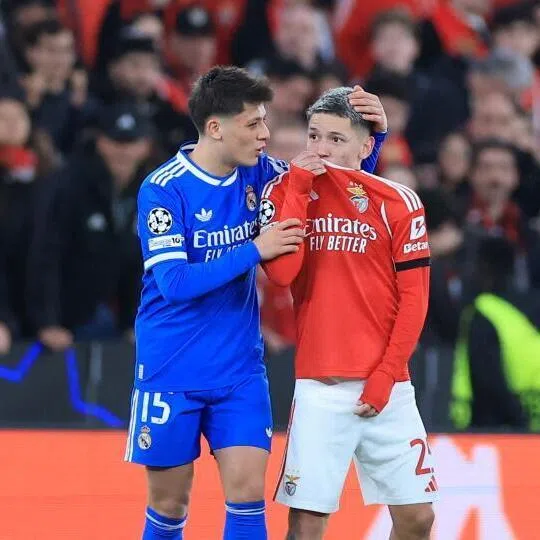 Benfica's Argentine forward Gianluca Prestianni covering his mouth while arguing with Real Madrid's Brazilian forward Vinicius Junior who complained about alleged racists insults during the UEFA Champions League match on Feb 17, 2026.