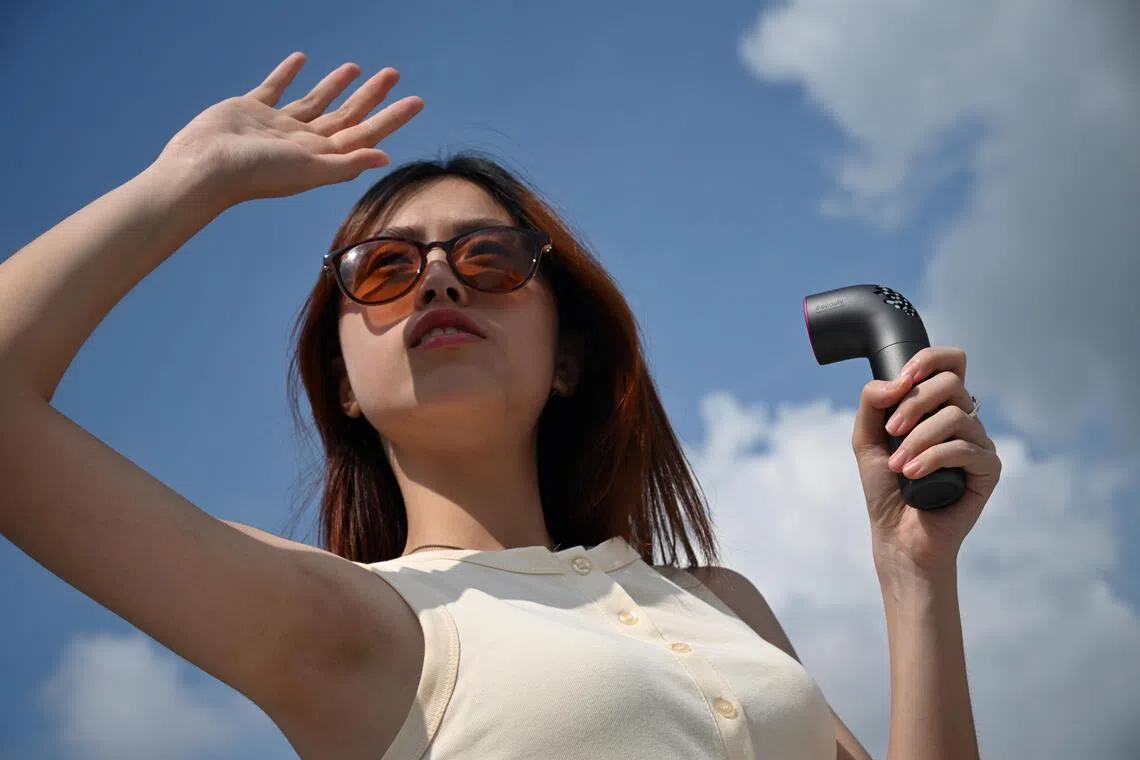 A woman holding the Aecooly Aero Ultra.