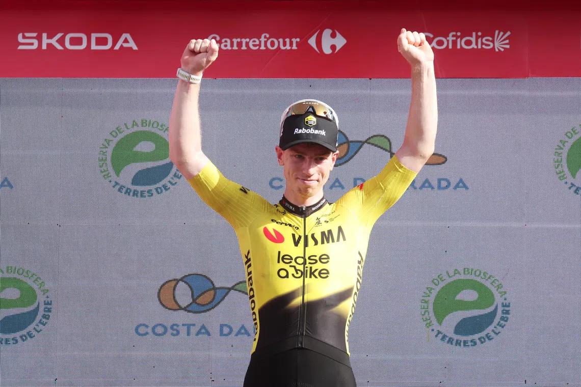 Cycling - Vuelta a Espana - Stage 5 - Falset to Roquetes - Roquetes, Spain - August 26, 2026 Team Visma | Lease a Bike's James Matthew Brennan celebrates on the podium after winning stage 5 REUTERS/Bruna Casas