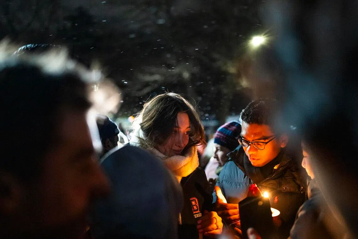 Mourners for the victims of the shooting at Brown University gather for a candlelight vigil on Dec 14, 2025.