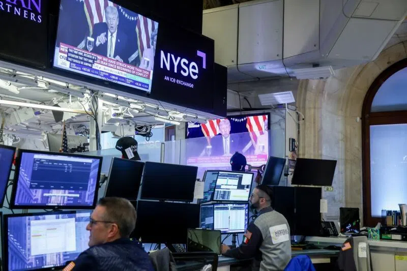 A TV station broadcasts US President Donald Trump on the floor of the New York Stock Exchange in New York City, on March 16.