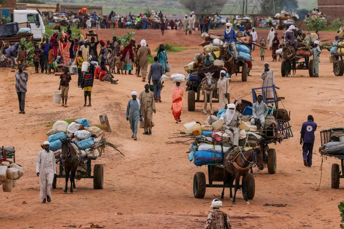 People fleeing the violence in West Darfur, cross the border into Adre, Chad, on Aug 4, 2023.
