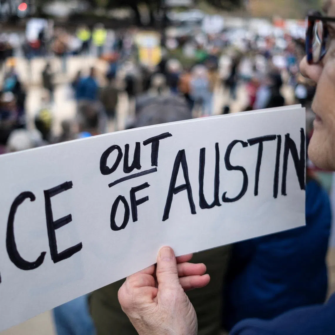 Christi Eubank protests against cooperation of the city of Austin with U.S. Immigration and Customs Enforcement (ICE) agents, in Austin, Texas, U.S., January 20, 2026.   REUTERS/Joel Angel Juarez