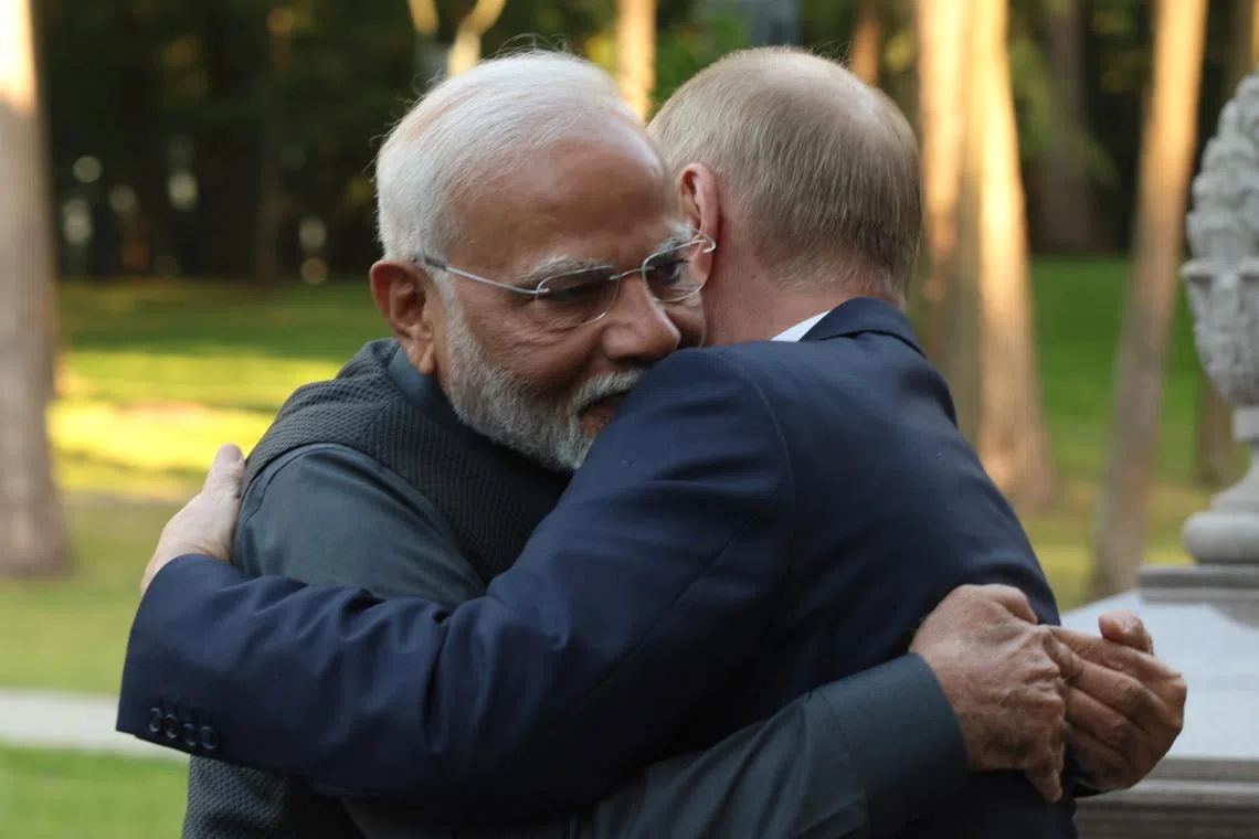 Russian President Vladimir Putin (right) welcomes Indian Prime Minister Narendra Modi before their official meeting.