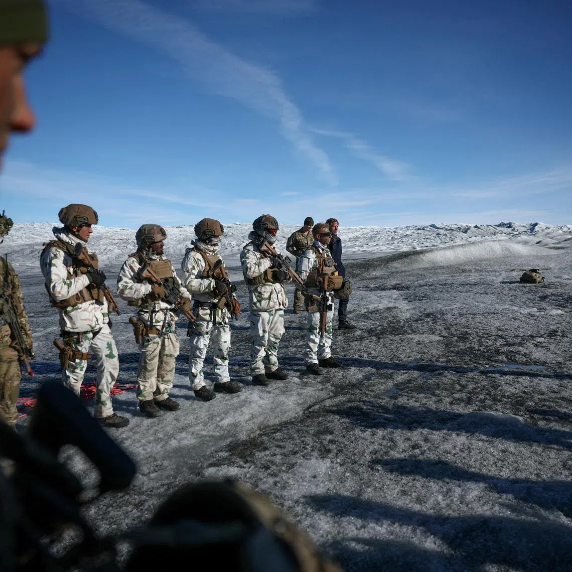 FILE PHOTO: Chief of Joint Arctic Command, Major General Soren Andersen speaks to members of the Danish and French armed forces during a military drill as Danish, Swedish, and Norwegian home guard units together with Danish, German and French troops take part in joint military drills in Kangerlussuaq, Greenland, September 17, 2025. REUTERS/Guglielmo Mangiapane/File Photo