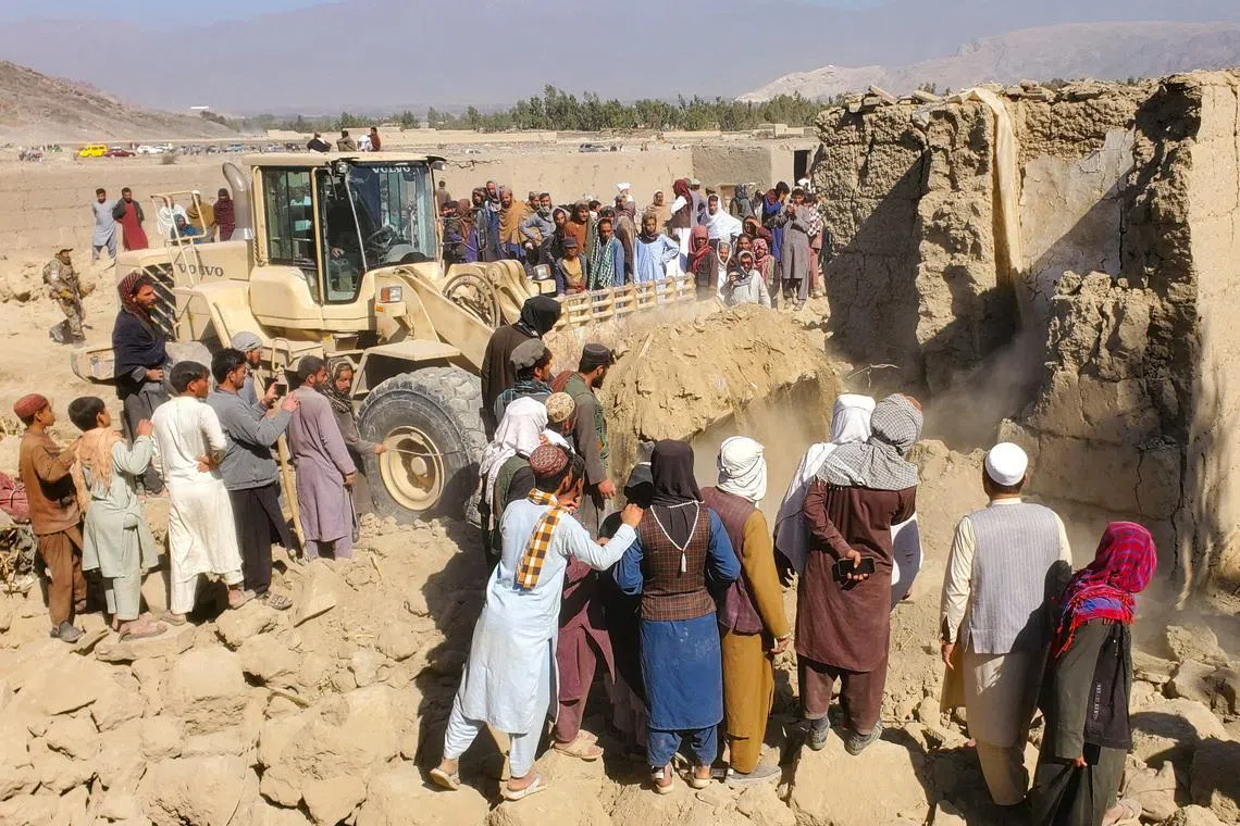 Residents gather at the site, following the Pakistani airstrikes, in Bihsud district, Nangarhar province, Afghanistan, February 22, 2026. REUTERS/Stringer
