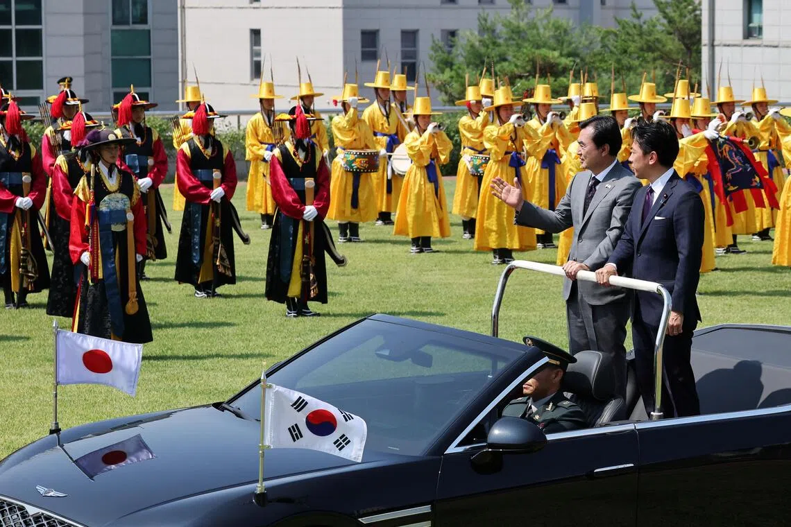 Japanese Defence Minister Shinjiro Koizumi (right) and South Korean Defence Minister Ahn Gyu-back inspecting honor guards during a welcoming ceremony in Seoul on June 28.