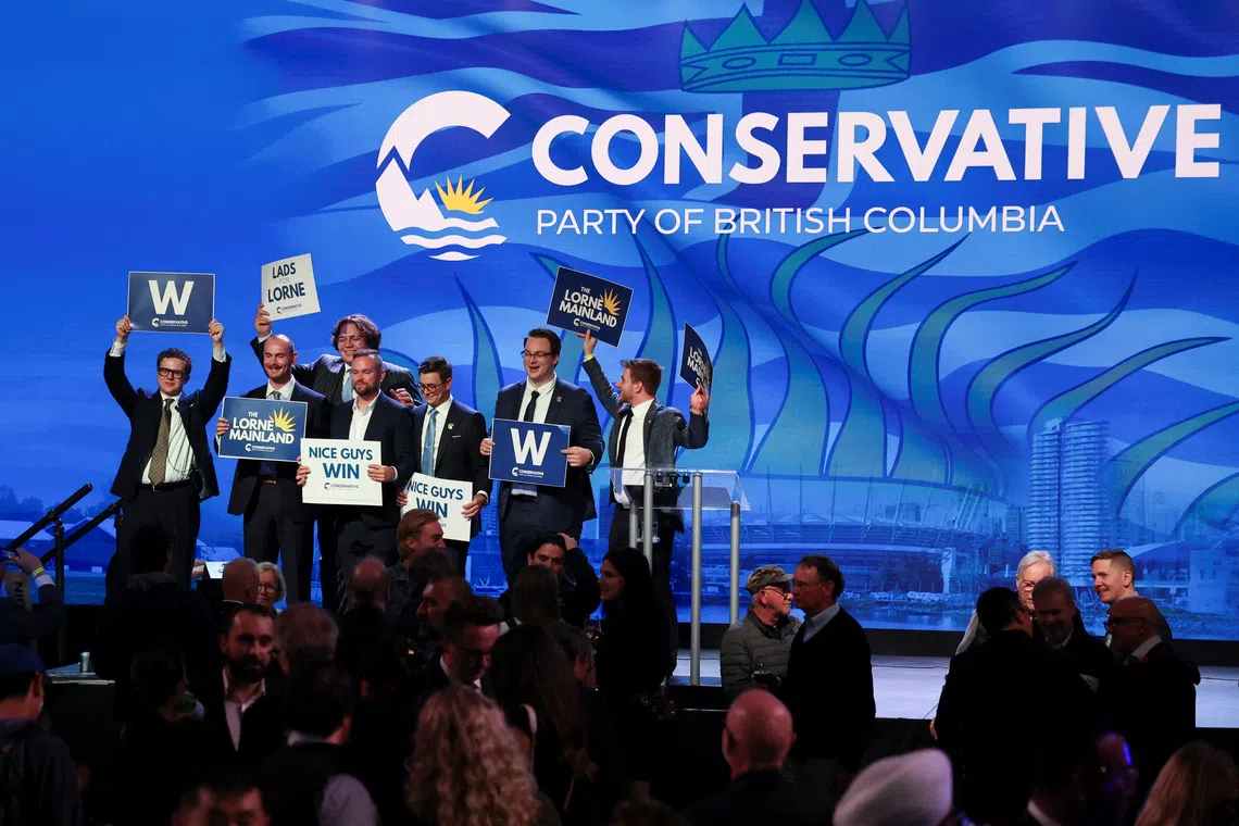 Image 3: Supporters gather on stage, following local media projections of a Conservative majority government, at the provincial election night party of BC Conservative Party interim leader Lorne Doerkson in Vancouver, British Columbia, Canada, October 24, 2026.  REUTERS/Chris Helgren