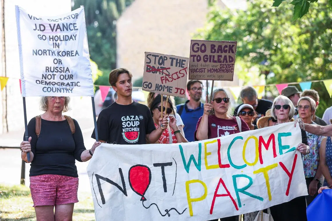 People protesting against US Vice-President J.D. Vance's visit to the English countryside and his politics on Aug 12 in Charlbury, in Britain's Cotswolds, an Area of Outstanding Natural Beauty.