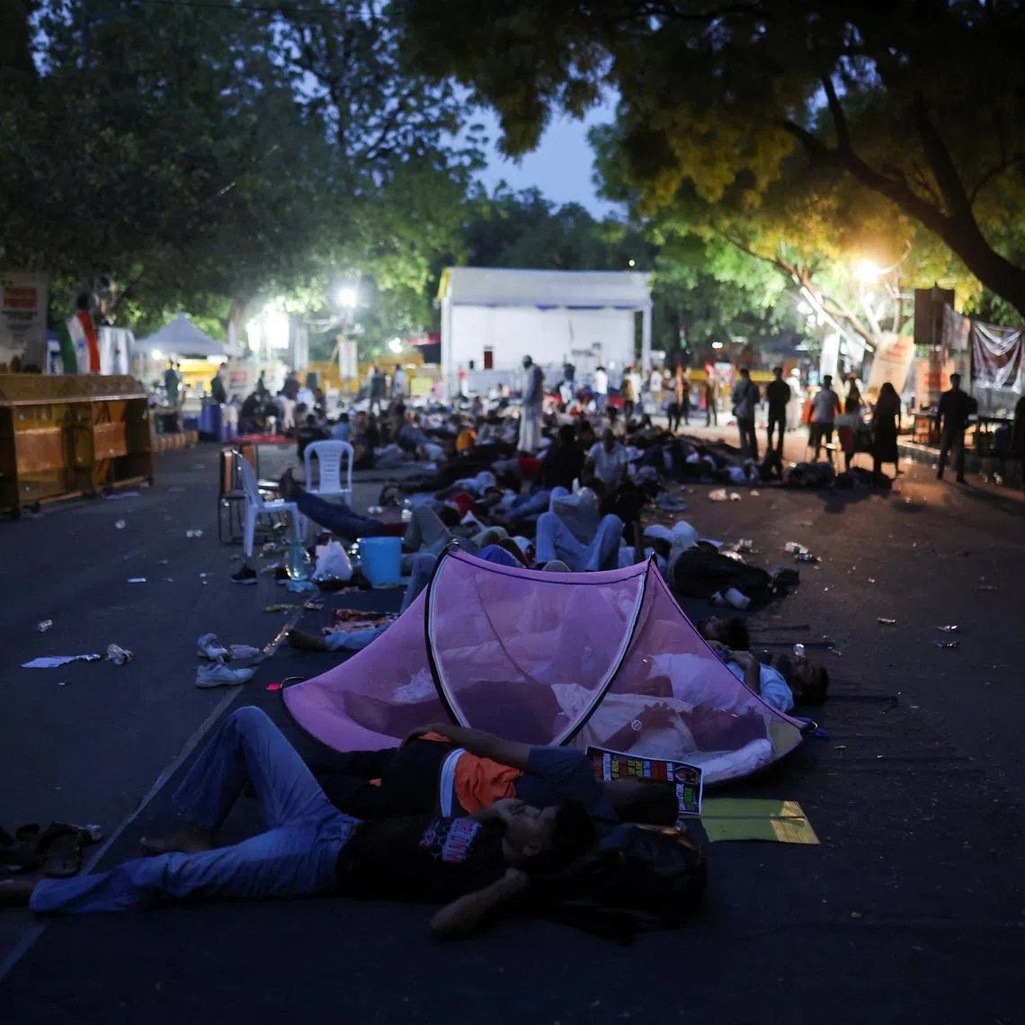 A person sleeps inside a mosquito net during a sit in protest called by Cockroach Janta Party (CJP) demanding the resignation of Indian Education Minister Dharmendra Pradhan, at Jantar Mantar in New Delhi, India, June 29, 2026. REUTERS/Anushree Fadnavis