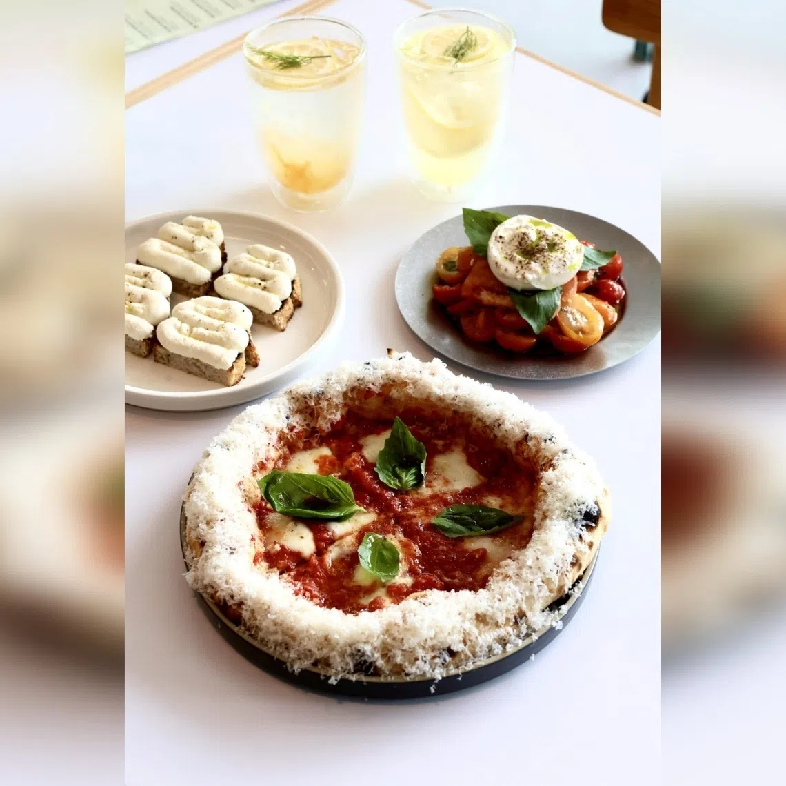 (Clockwise from top left) Sparkling Yuzu, Sparkling Lemonade, Burrata Tomato Salad, Margherita and Ricotta Crostini.