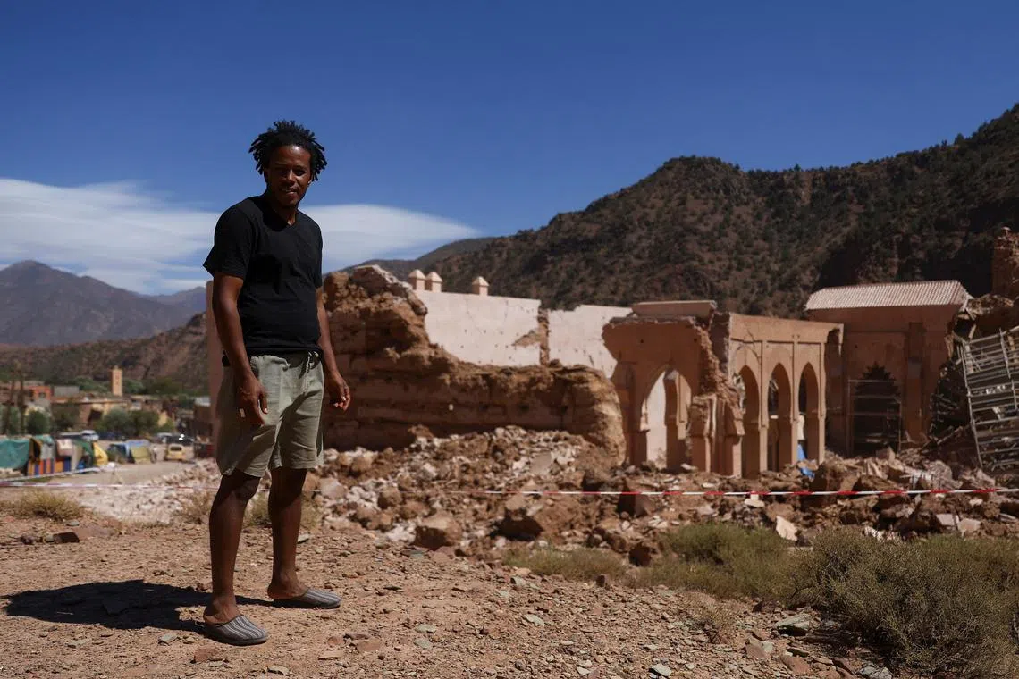 Mr Said Hartattouch in front of the damaged Tinmel Mosque, in Morocco.