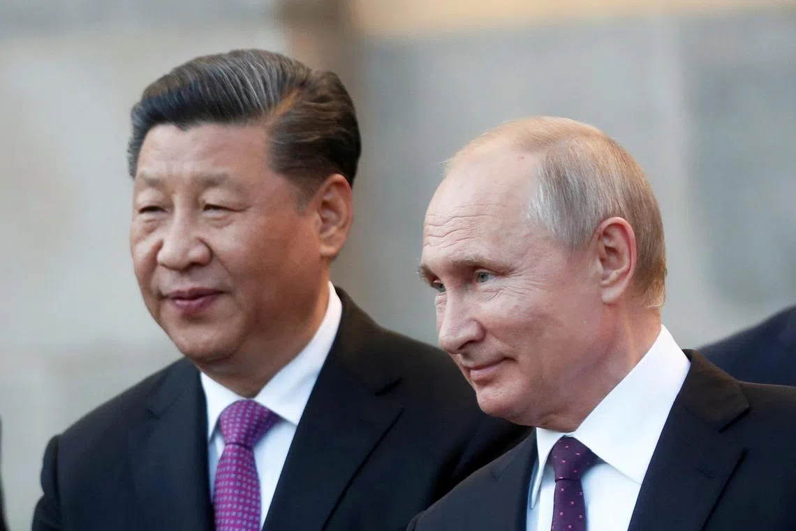 FILE PHOTO: Chinese President Xi Jinping and Russian President Vladimir Putin attend a presentation of a Haval F7 SUV produced at the Haval car plant located in Russian Tula region, at the Kremlin in Moscow, Russia, June 5, 2019. Maxim Shipenkov/Pool via Reuters/File Photo