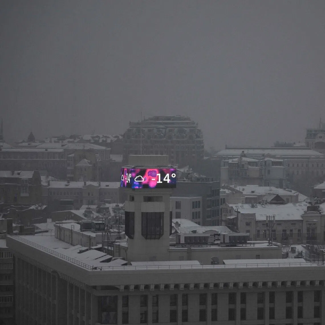 A big screen on a building in Kyiv on Jan 14 displaying a temperature of minus 14 deg C.