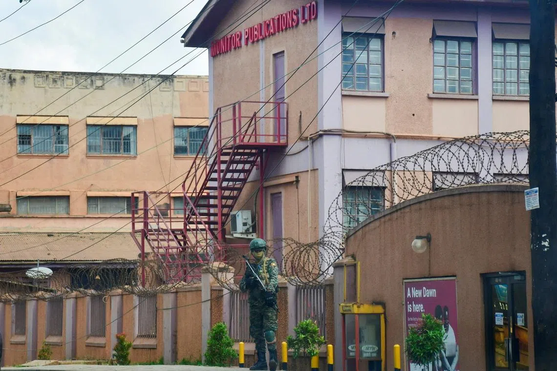 A member of Uganda People's Defence Forces stands at the headquarters of Nation Media Group - Uganda, (NMG-U), a building that houses Daily Monitor, KFM and Dembe FM radios, as government closes the media house, in Kampala, Uganda, June 28, 2026. REUTERS/Stringer