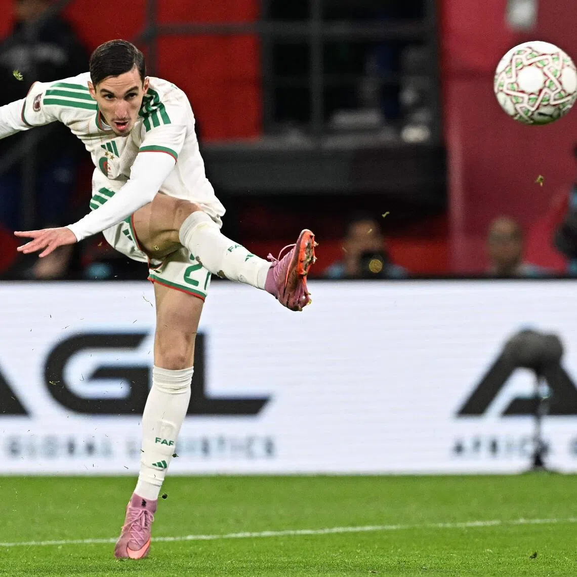 Striker Adil Boulbina scores the winning goal for Algeria in extra time against the  Democratic Republic of Congo.