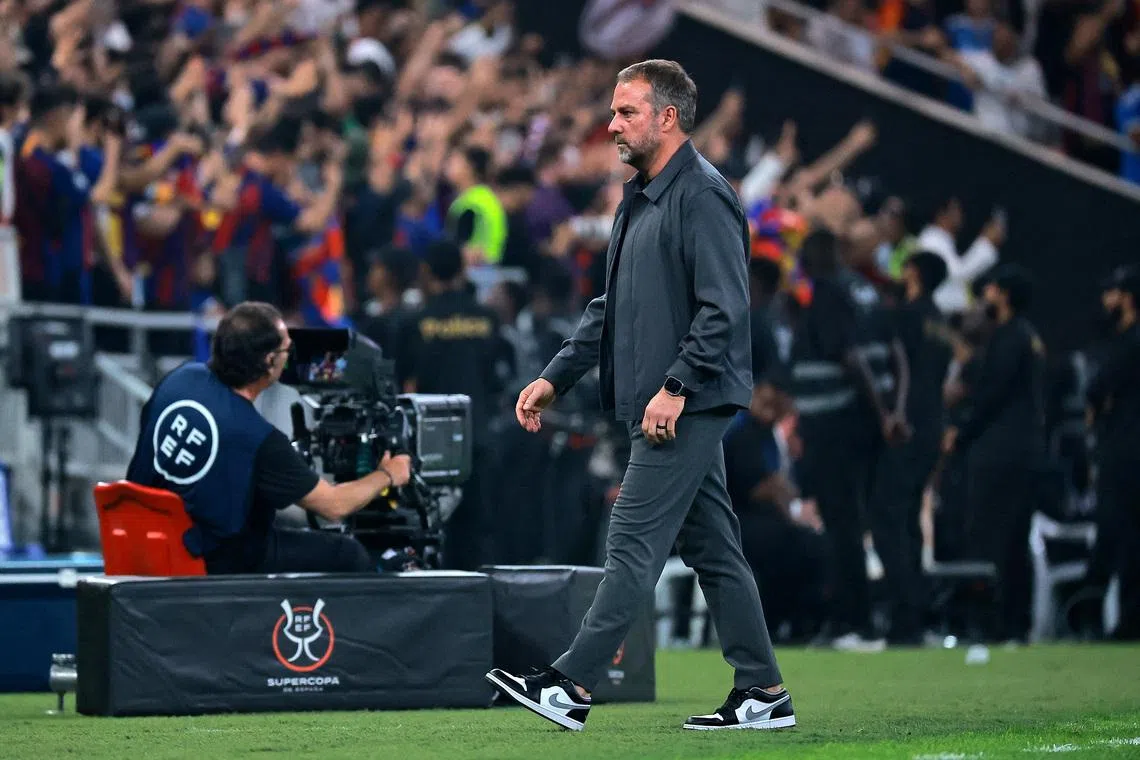 Soccer Football - Spanish Super Cup - Final - FC Barcelona v Real Madrid - King Abdullah Sports City Stadium, Jeddah, Saudi Arabia - January 11, 2026  FC Barcelona coach Hansi Flick reacts after FC Barcelona's Robert Lewandowski scored their second goal REUTERS/Stringer