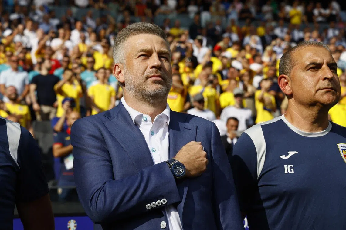 FILE PHOTO: Soccer Football - Euro 2024 - Group E - Slovakia v Romania - Frankfurt Arena, Frankfurt, Germany - June 26, 2024 Romania coach Edward Iordanescu during the national anthems before the match REUTERS/Wolfgang Rattay/File Photo