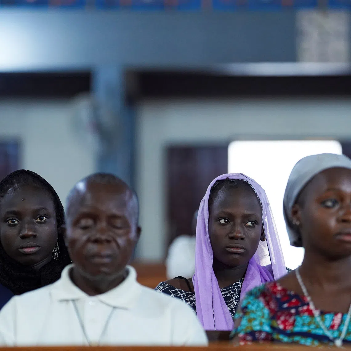 Worshippers attend an evening mass at St. Michael Cathedral on Bosso Road in Minna, Niger State, Nigeria, December 4, 2025. REUTERS/Marvellous Durowaiye