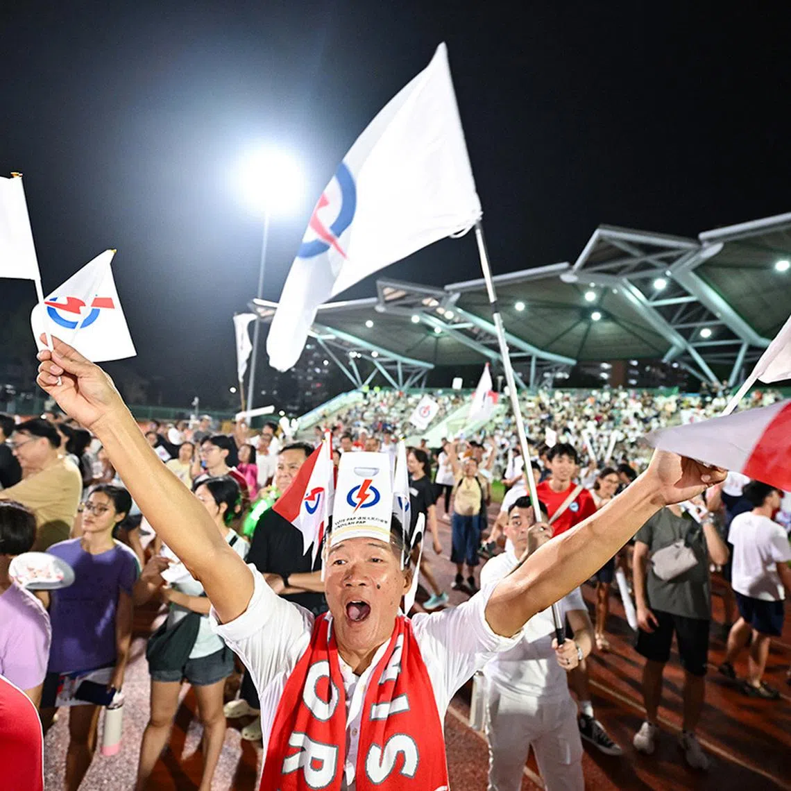 MAIN PIX ST20250501-202599000341-Lim Yaohui-Isabelle Liew-ilrally01/ Mr Barry Ong, 57, Lifeguard, cheering for Dr Faisal Abdul Aziz, PAP candidate for Aljunied GRC, when he is speaking at the rally at Serangoon stadium on May 1, 2025. (ST PHOTO: LIM YAOHUI)