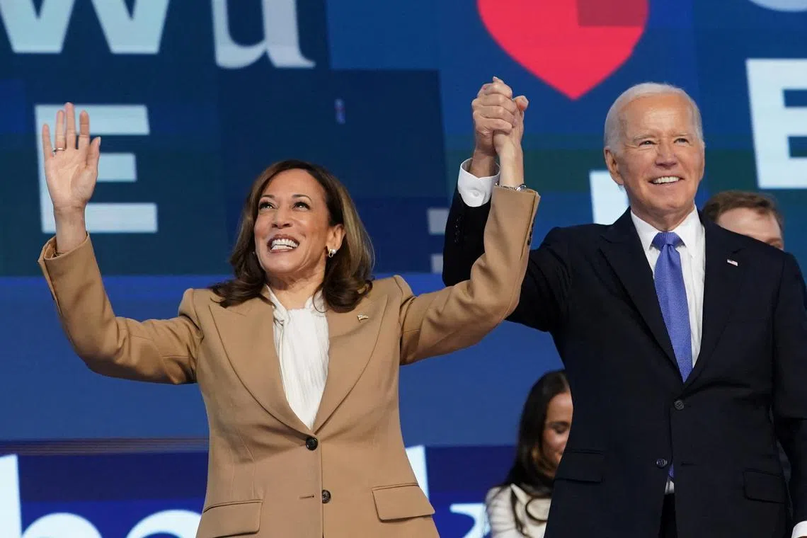 FILE PHOTO: U.S. President Joe Biden and Democratic presidential candidate and U.S. Vice President Kamala Harris reacts onstage at the Democratic National Convention (DNC) in Chicago, Illinois, U.S., August 19, 2024. REUTERS/Kevin Lamarque/File Photo