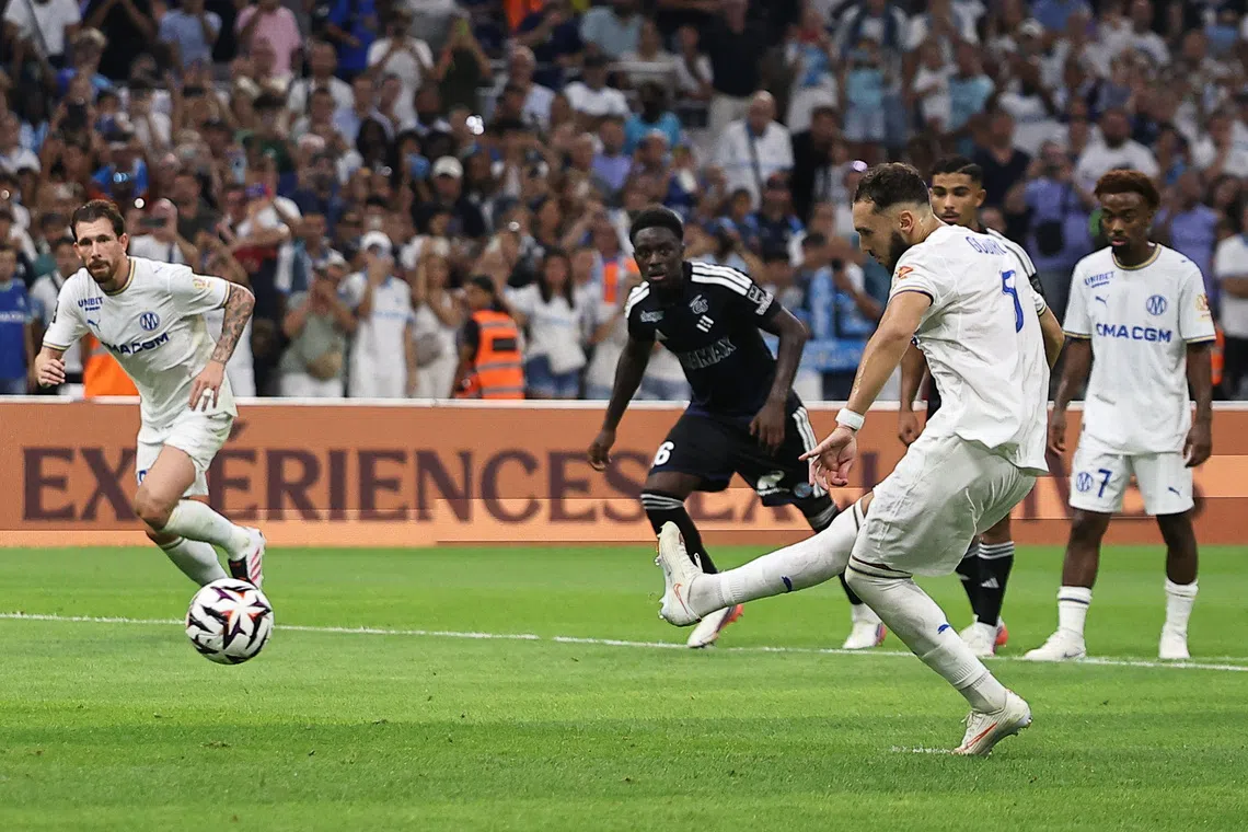 Soccer Football - Ligue 1 - Olympique de Marseille v RC Strasbourg - Orange Velodrome, Marseille, France - August 21, 2026 Olympique de Marseille's Amine Gouiri scores their second goal from the penalty spot REUTERS/Manon Cruz