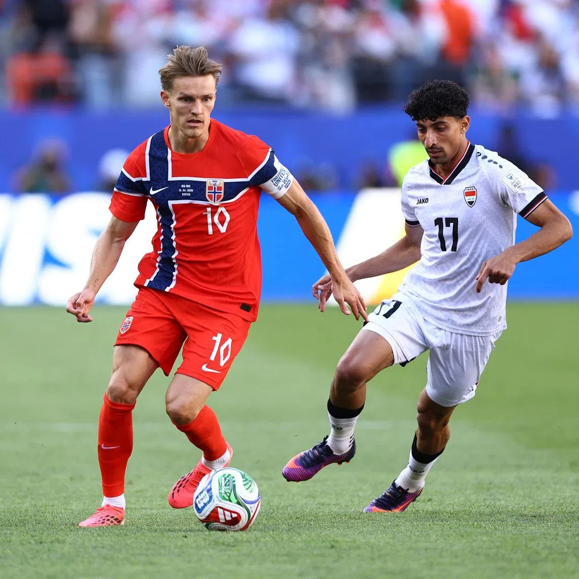 Soccer Football - FIFA World Cup 2026 - Group I - Iraq v Norway - Boston Stadium, Foxborough, Massachusetts, U.S. - June 16, 2026 Norway's Martin Odegaard in action with Iraq's Ali Jasim REUTERS/Peter Cziborra