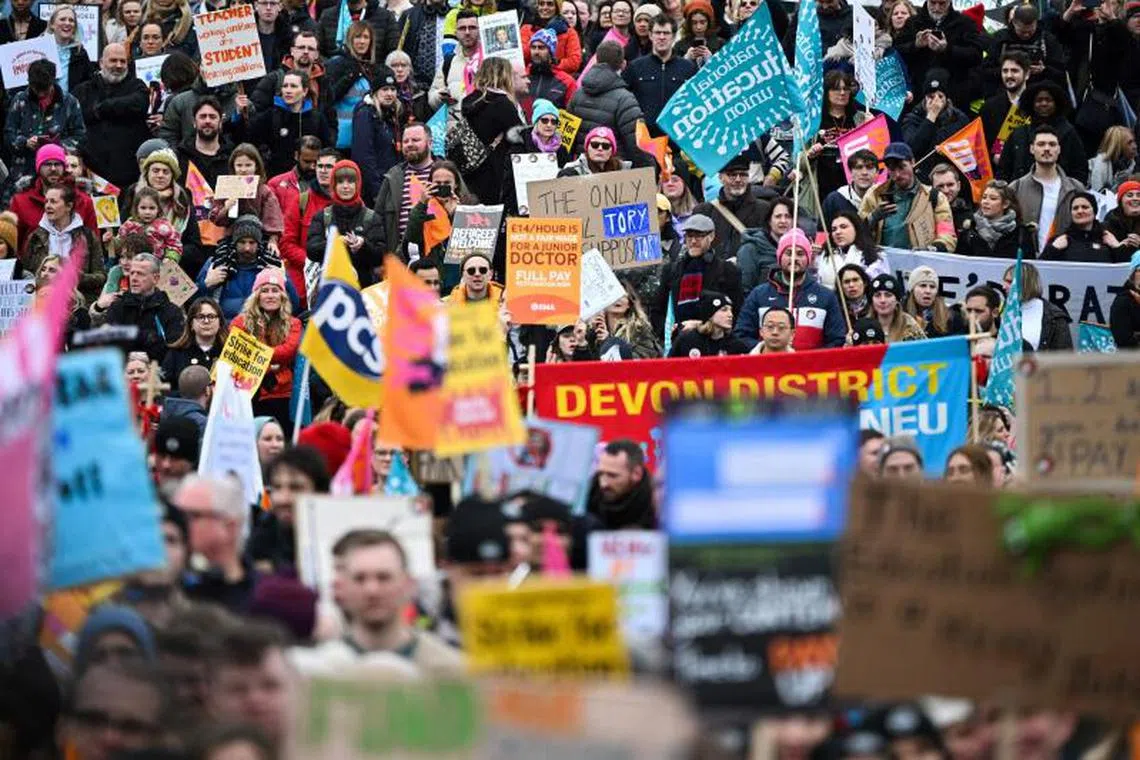 Demonstrators take part in a protest amid a dispute with the government over pay, in Trafalgar Square, London, on March 15, 2023.