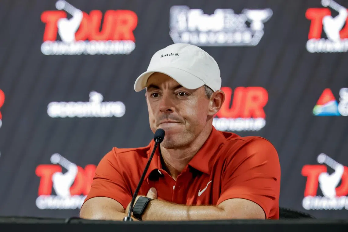 Rory McIlroy of Northern Ireland speaks to the news media during a practice round for the 2025 Tour Championship.
