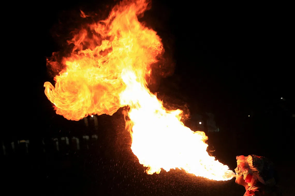 An artiste performing during a demonstration in support of Venezuela's sovereignty, amid rising tensions between the U.S. and Venezuela, in Port of Spain, Trinidad and Tobago, on Dec7, 2025. 