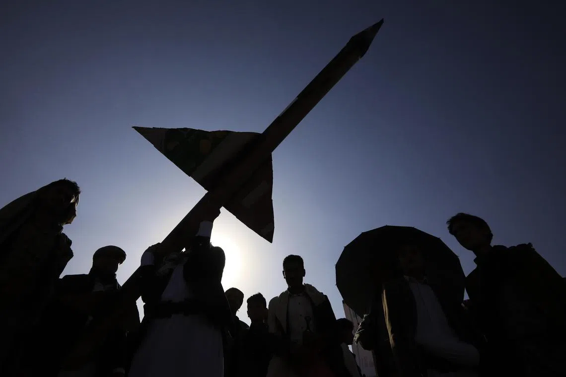 Houthi supporters during an anti-US and anti-Israel protest in Sanaa, Yemen on Dec 27. Israel had struck Sanaa's international airport a day earlier, with Yemen retaliating on Dec 28.